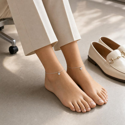 Silver Heart Charm Anklet styled on both ankles